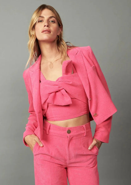 pink cropped corduroy blazer with two buttons. Shown with matching pants