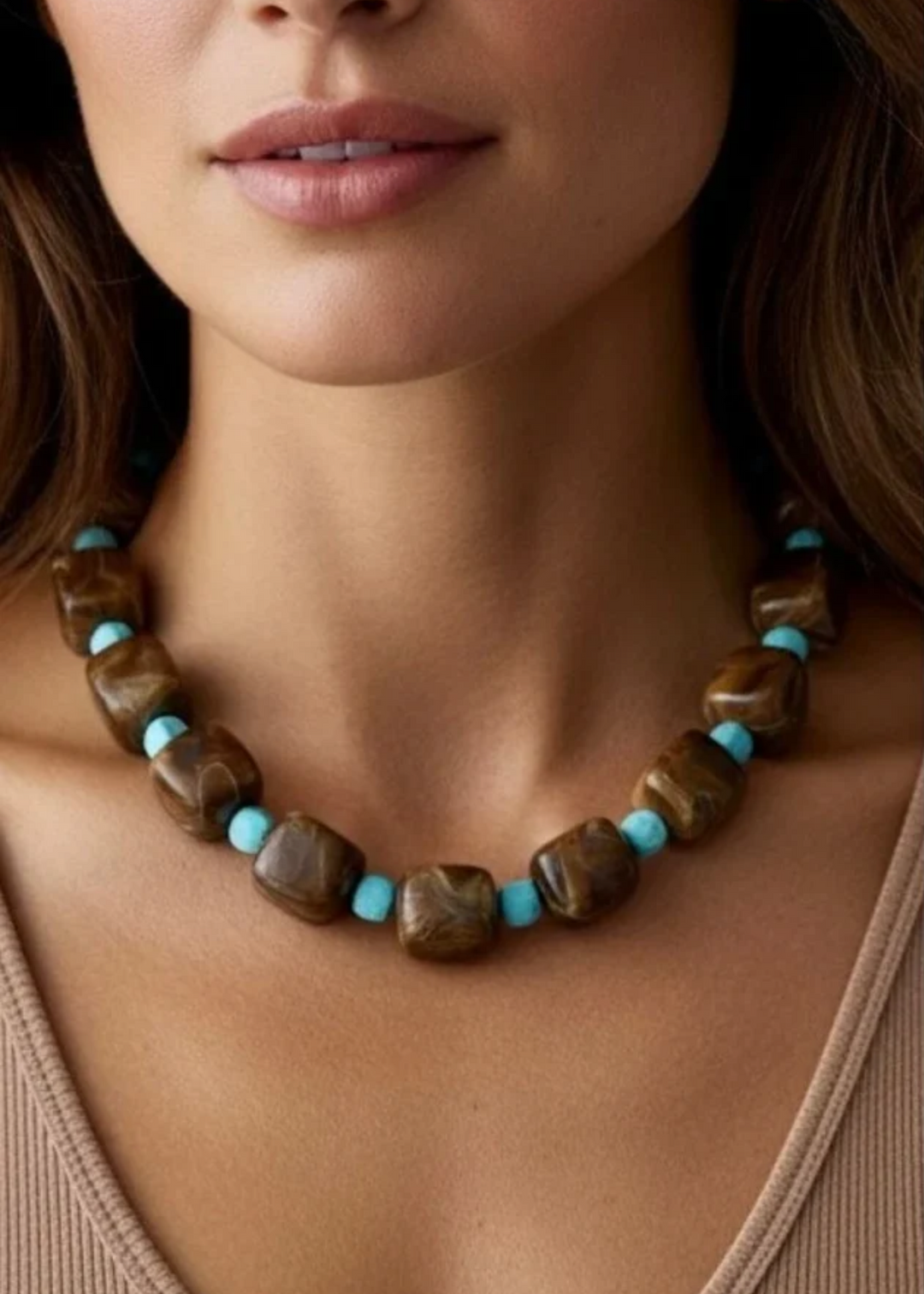 Woman modeling a brown square beaded necklace. 