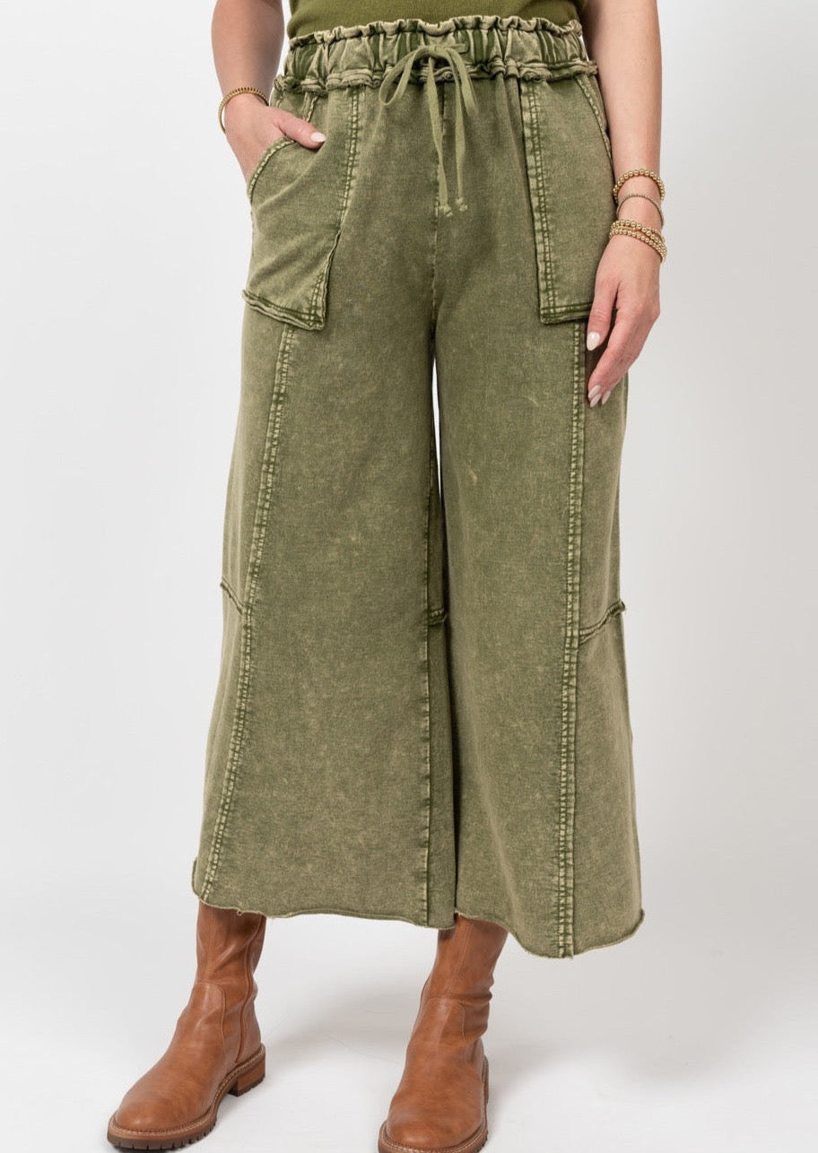 olive green wide leg washed sweatpants with drawstring waist and front seam details and pockets