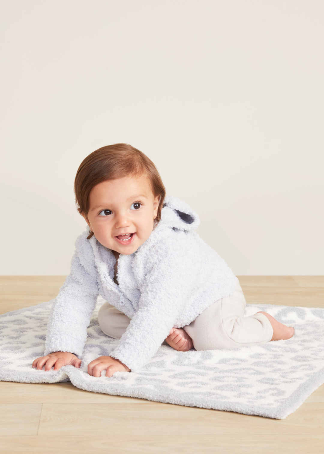 Baby wearing a blue hoodie