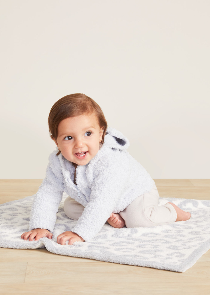 Baby wearing a blue hoodie