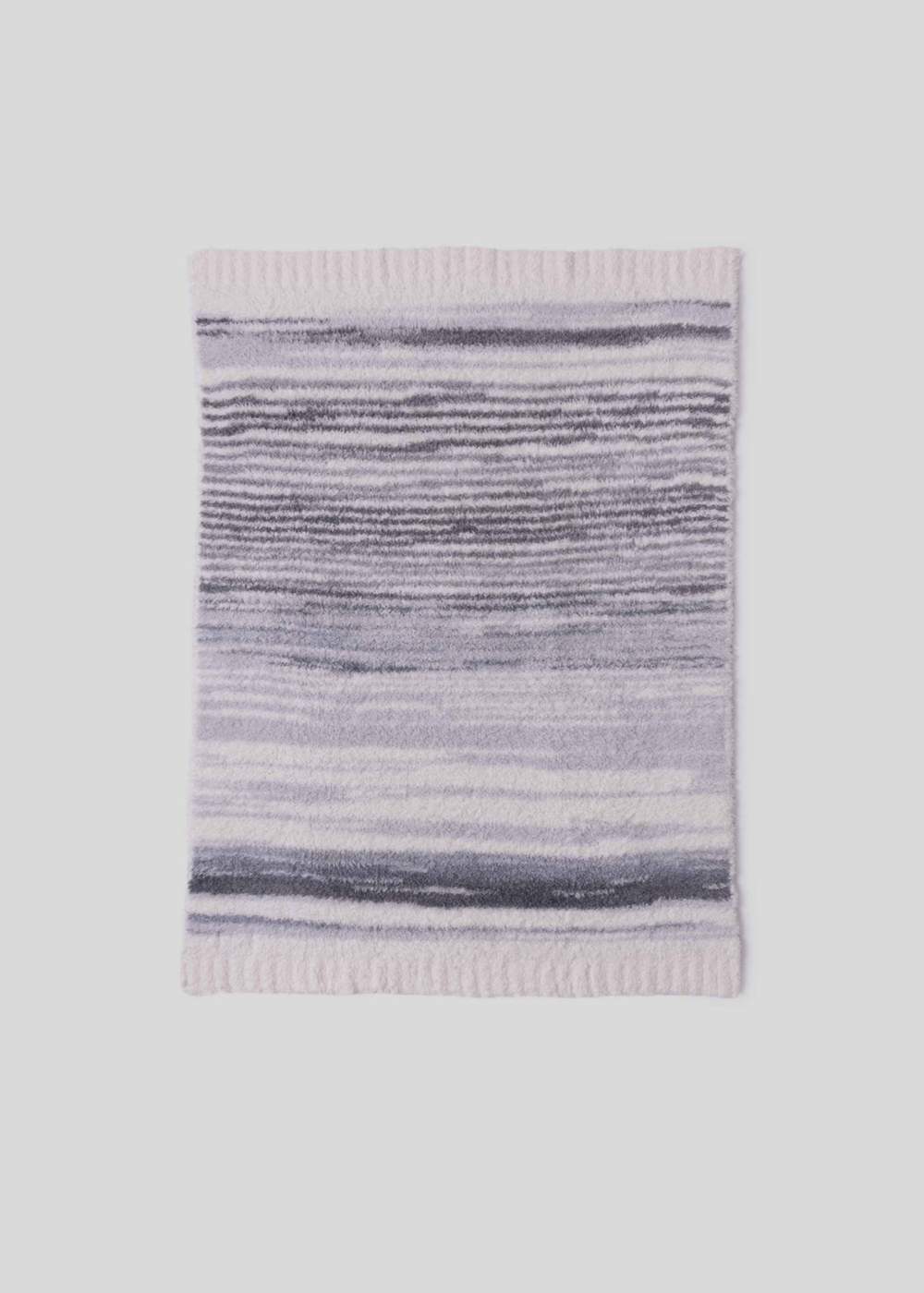 Blue, grey, and cream striped blanket laying on a white background