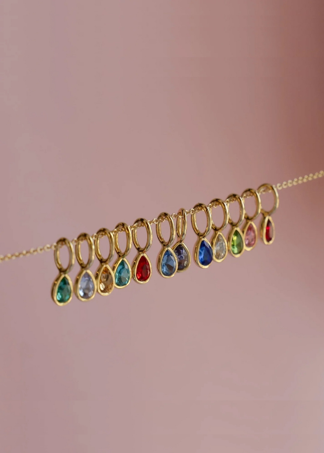 gold pear-shape birthstone mini charms hanging on delicate gold chain