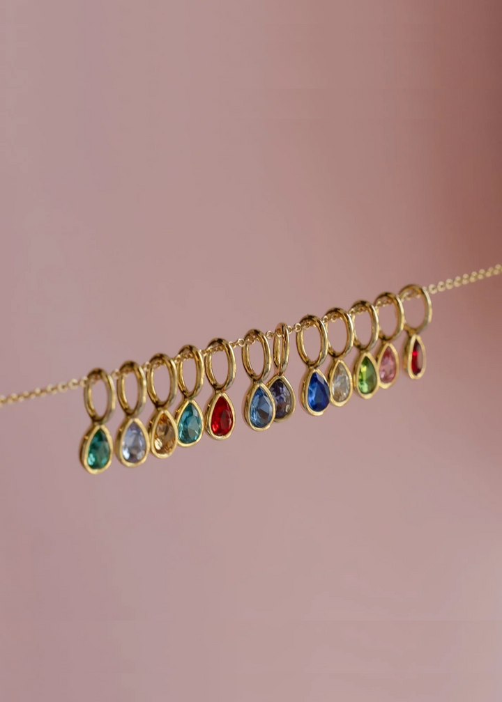 gold pear-shape birthstone mini charms hanging on delicate gold chain
