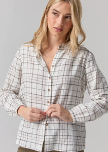 white and grey plaid button up top with no collar and elastic cuffs 