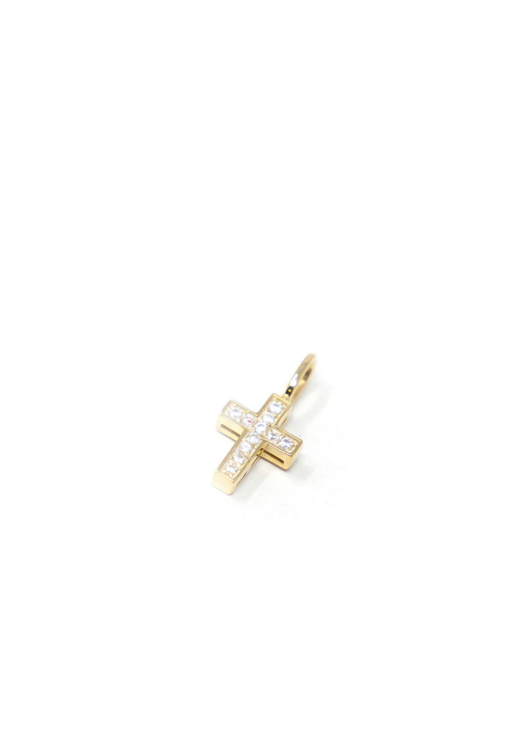 Gold and crystal cross charm on a white background