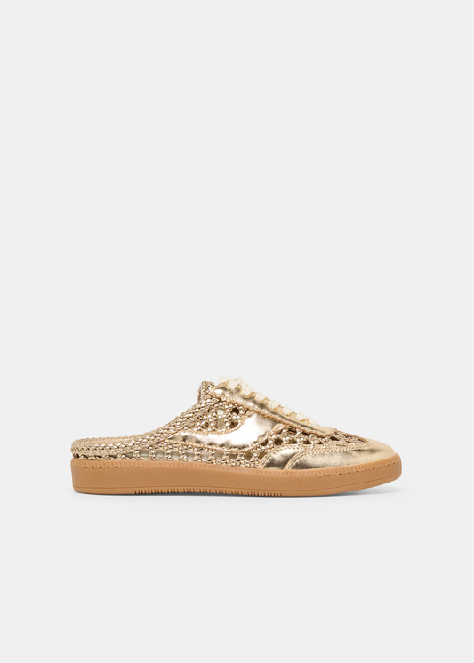 Gold woven slip on sneaker against a white background