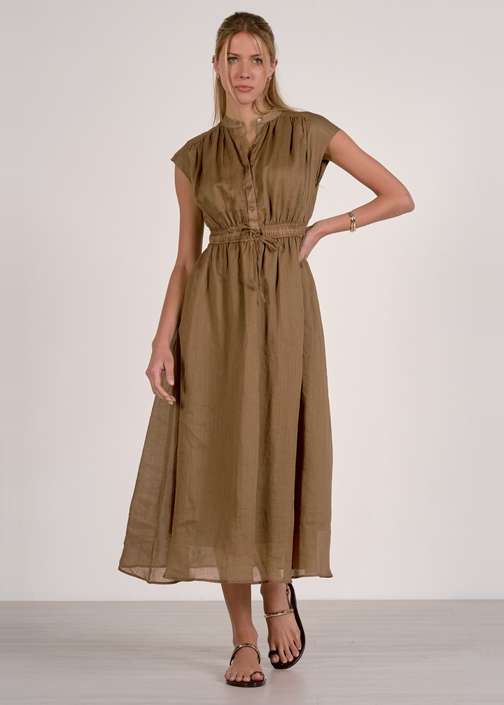 Woman wearing a brown midi dress with flats