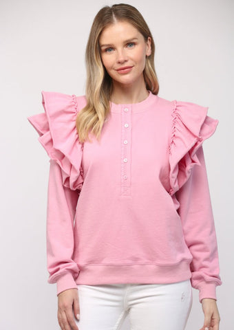 pink crew neck sweatshirt with 1/2 button front and bold ruffle sleeve details
