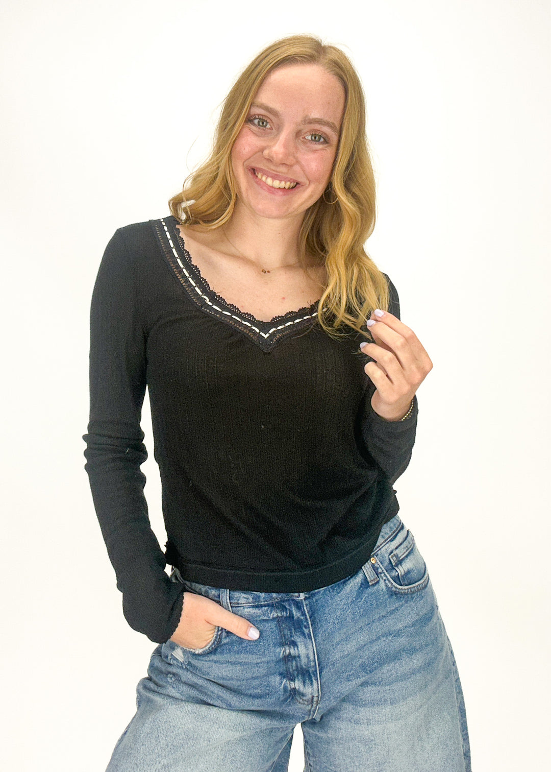 black long sleeve v-neck top with lave trim