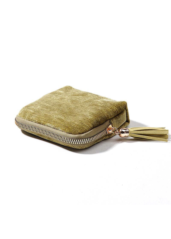 Velvet green jewelry organizer on a white background