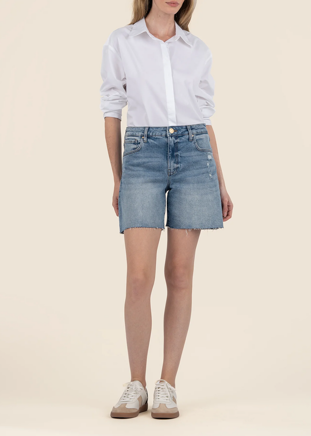 Women's medium wash high rise raw hem denim Bermuda shorts