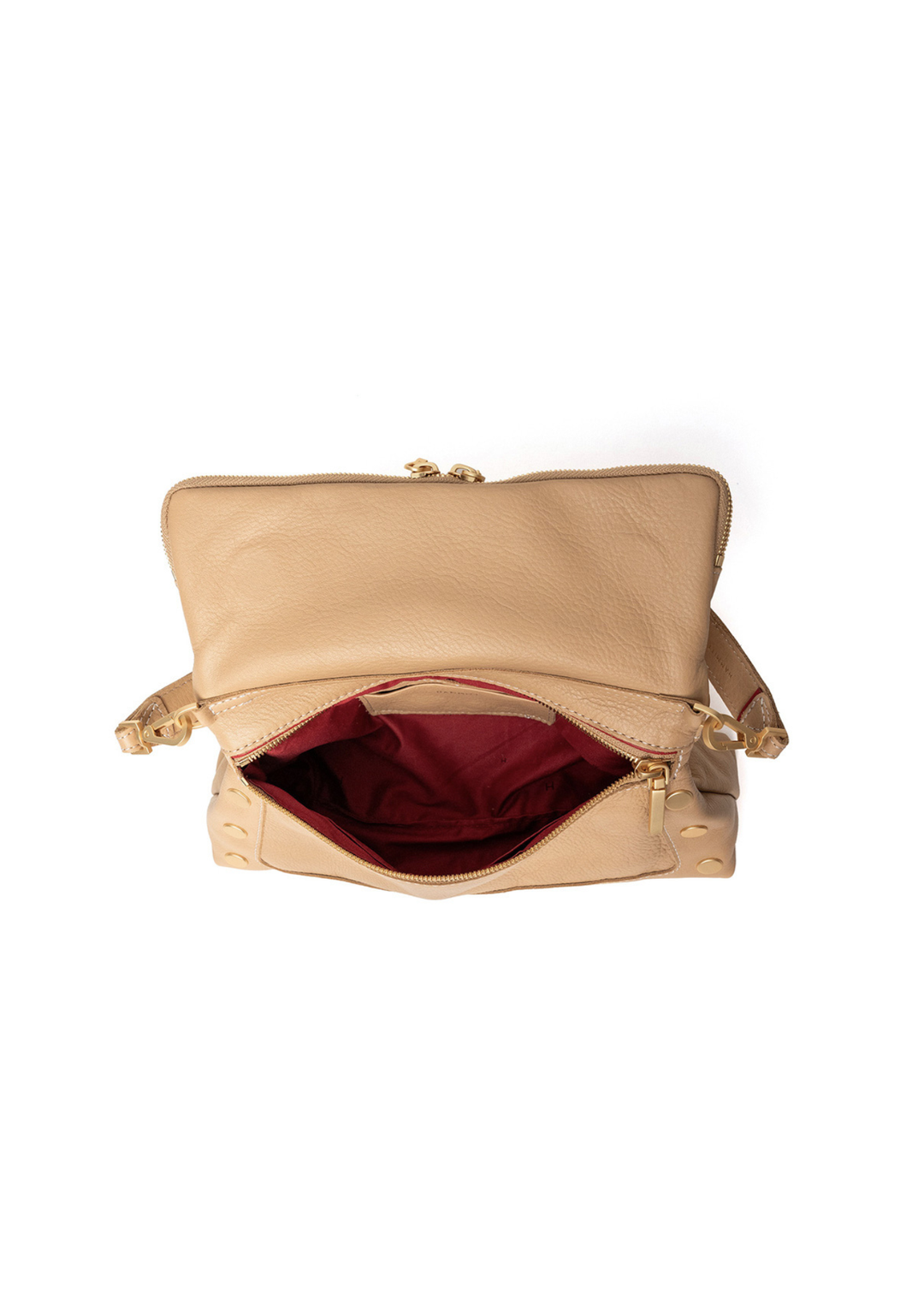 Tan handbag with gold accents sitting open against a white background