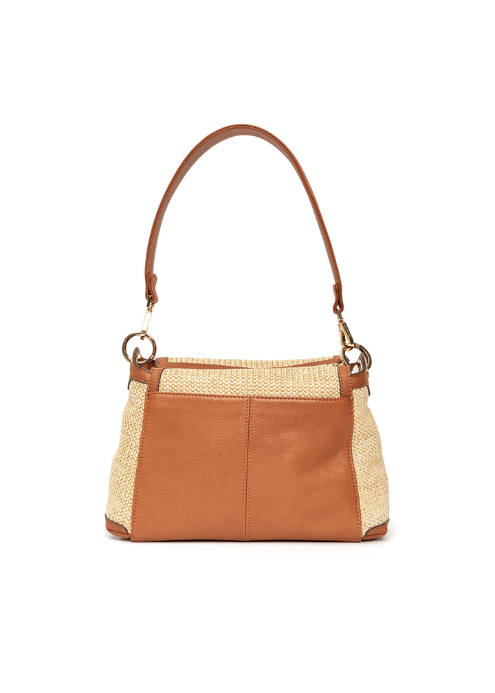 Back of a raffia and brown leather handbag with gold accents