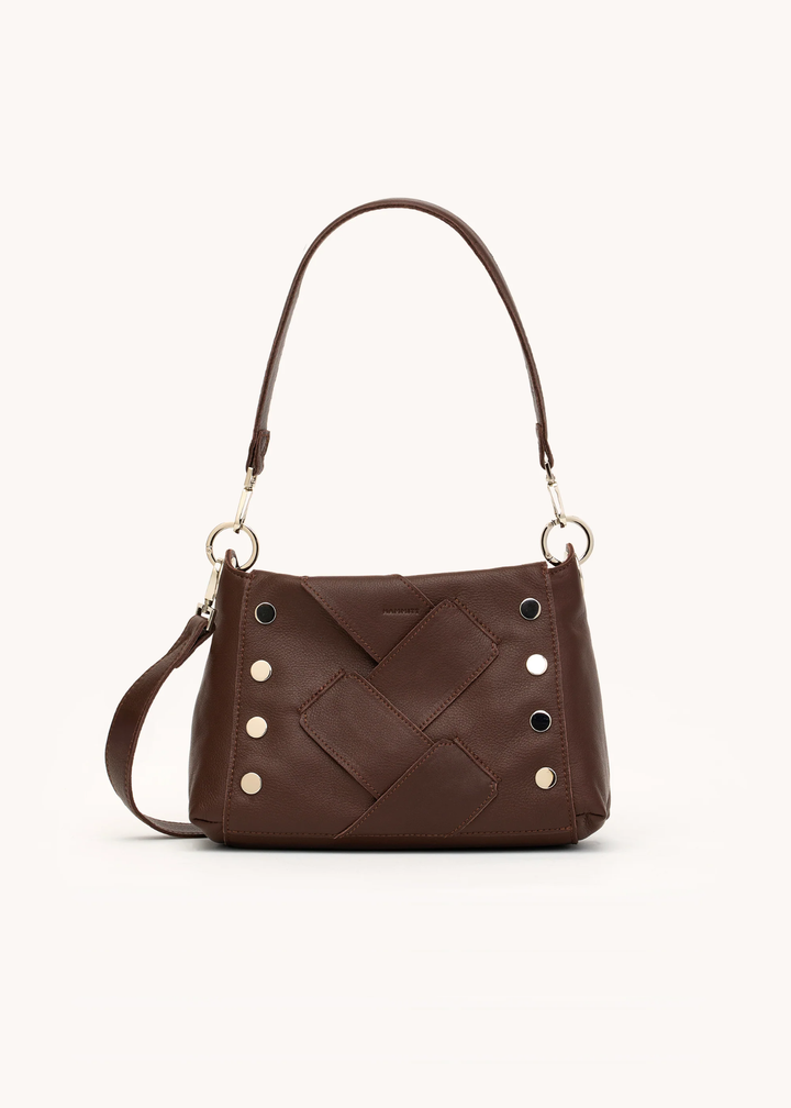 Brown leather woven purse with silver hardware on a white background