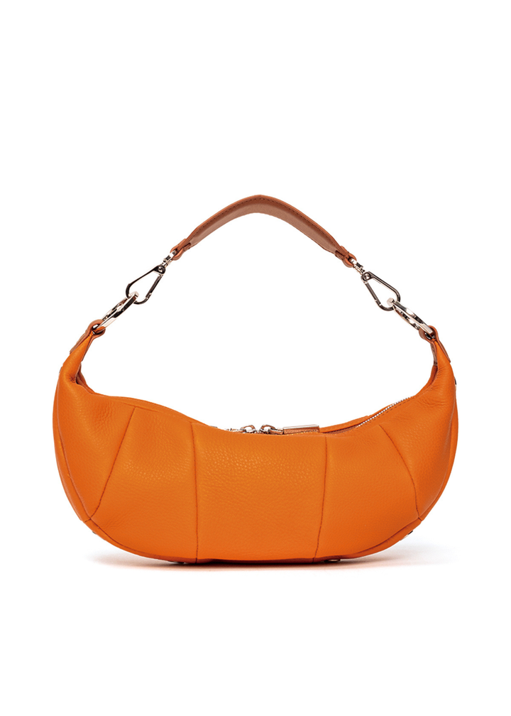 Back of an orange leather handbag with silver hardware