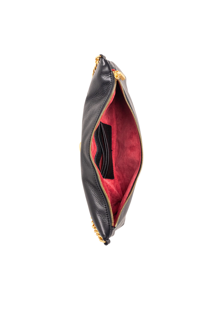 Black leather clutch with a red interior sitting open on a white background