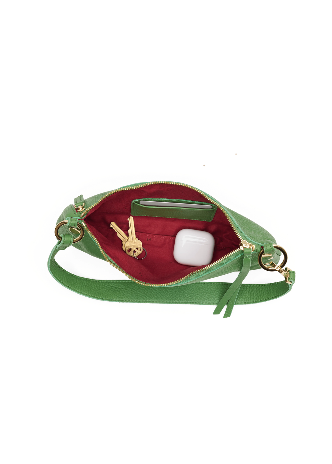 Green handbag with gold hardware on a white background