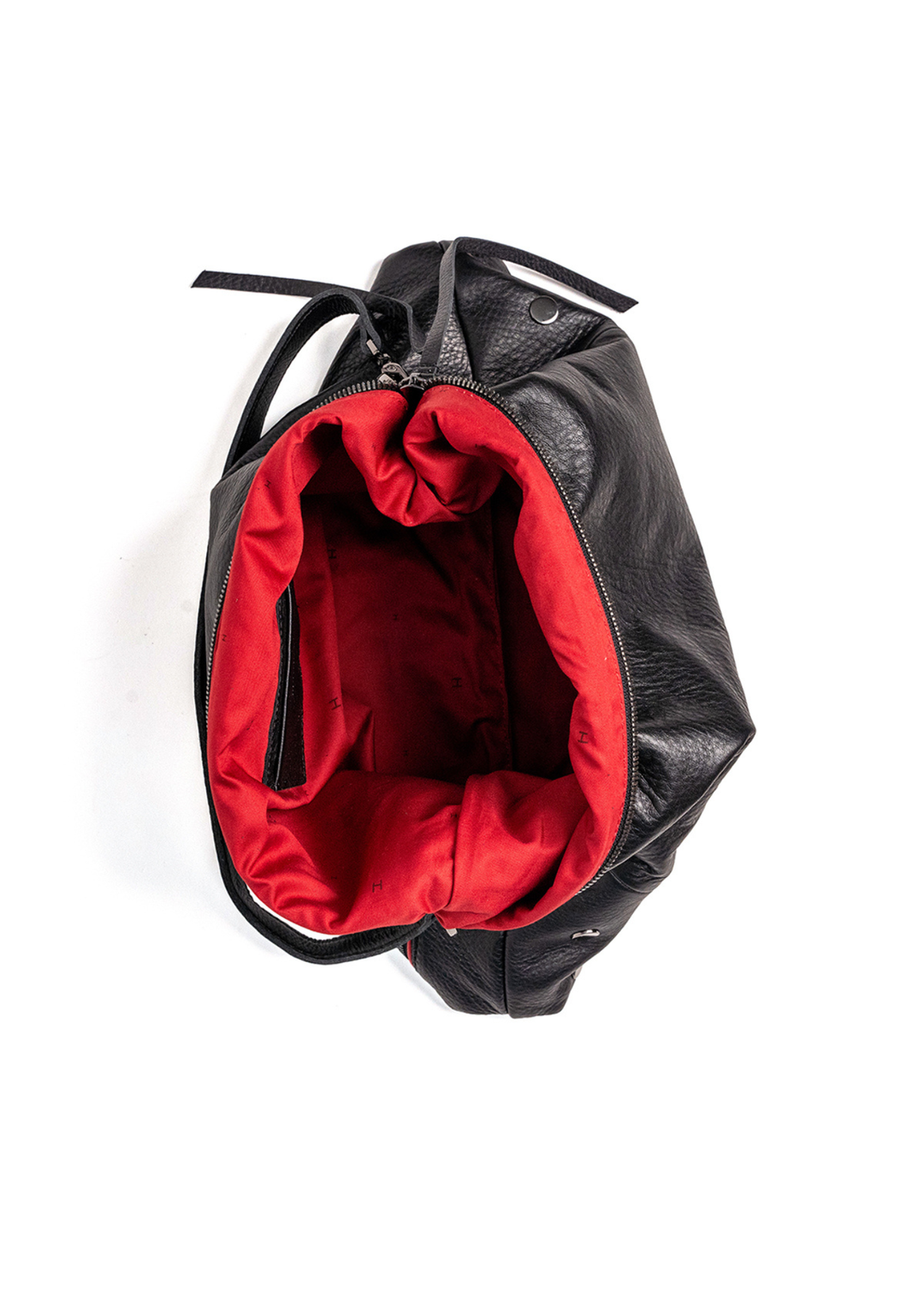 Large black handbag with red lining on a white background