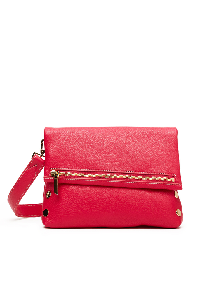 Hot pink leather purse on a white background