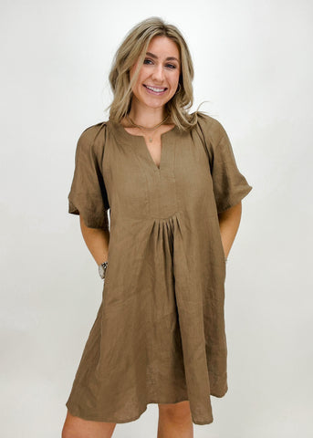 khaki color linen mini dress with short sleeves, split neck, and ruching for a flattering fit 
