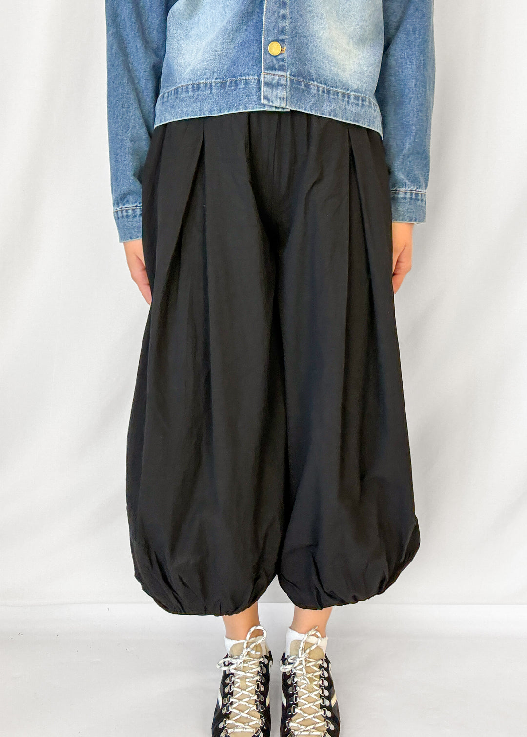 Woman wearing black balloon style pants