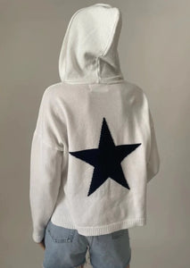 white sweater hoodie with navy star on back