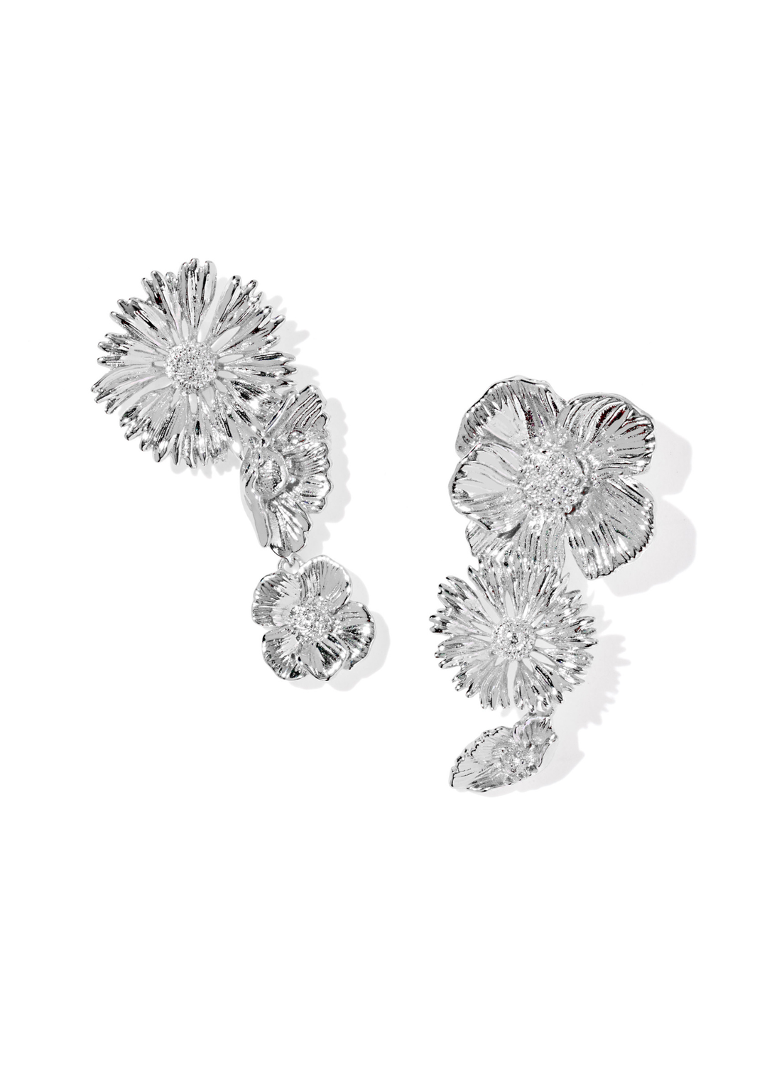 Rhodium flower shaped earrings on a white background