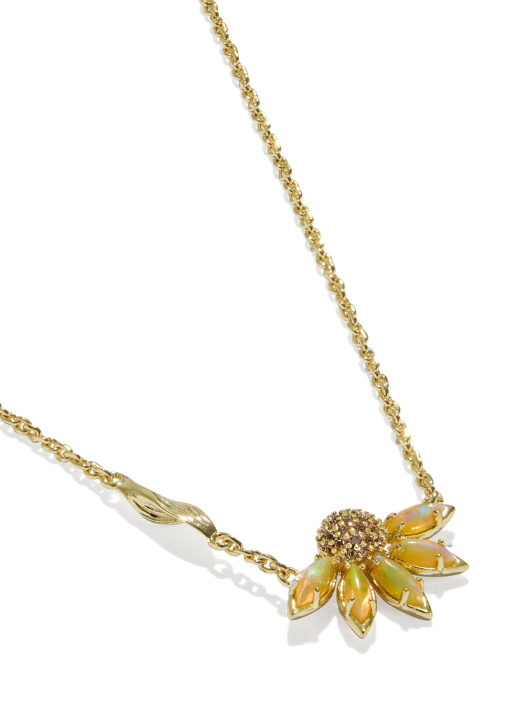Gold necklace with a yellow flower pendant