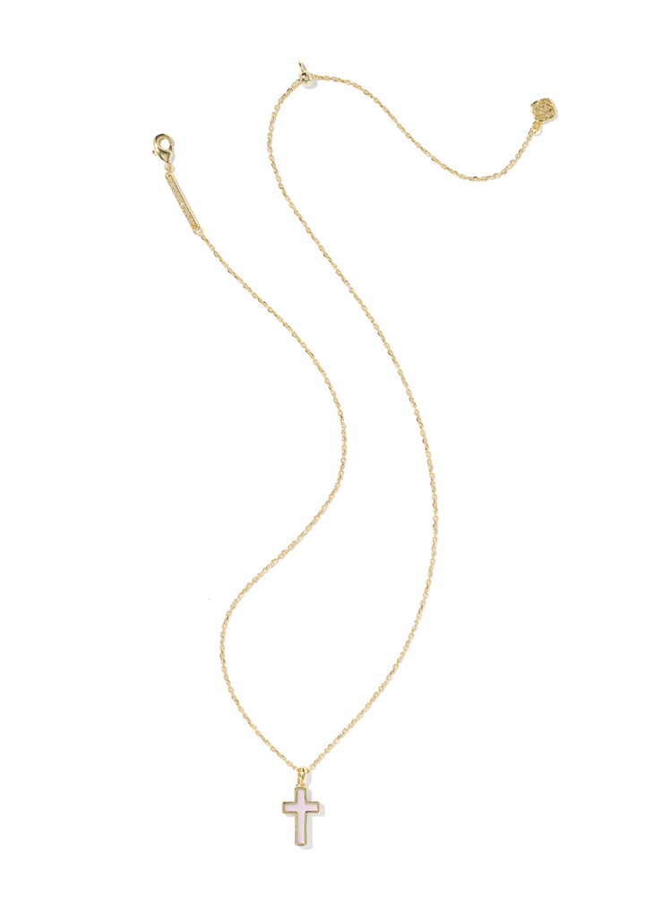 Gold framed cross pendant with a pink center stone on a gold chain