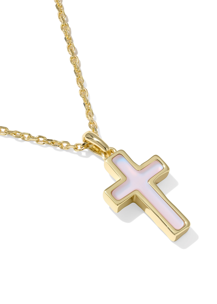 Gold framed cross pendant with a pink center stone on a gold chain