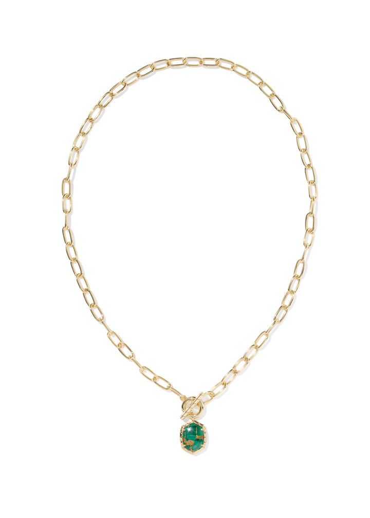 Gold link and chain necklace with a gold framed green malachite stone pendant on a white background