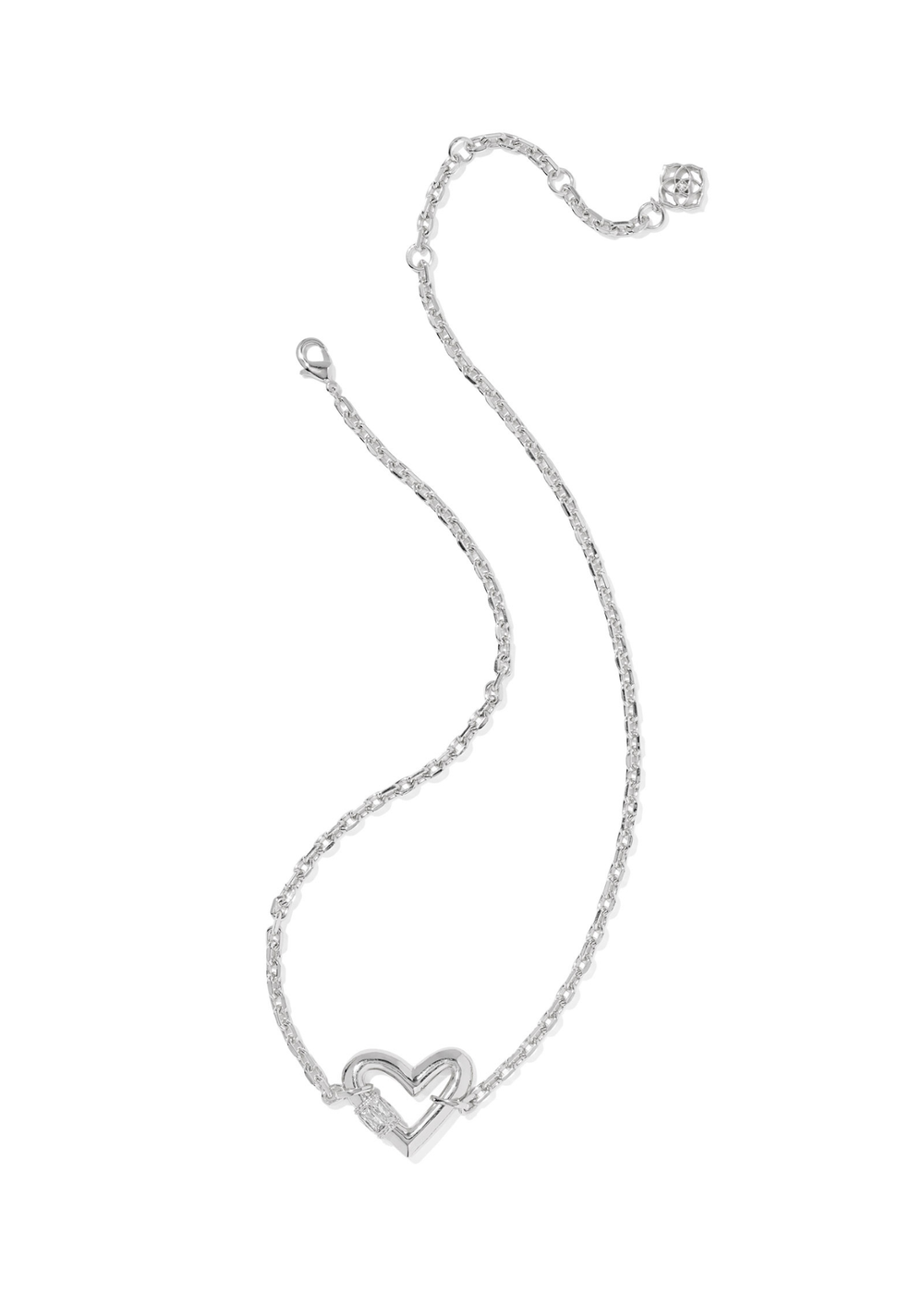 Rhodium necklace with a heart shaped pendant laying on a white background