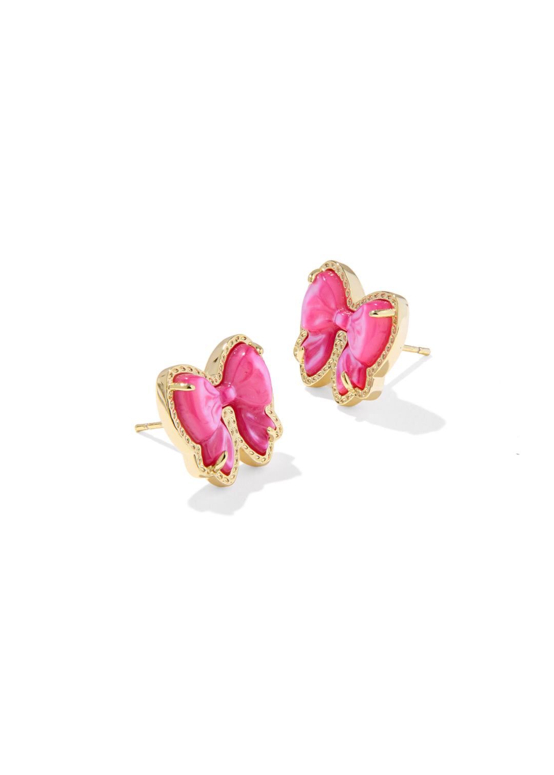 Gold framed pink bow shaped stud earrings on a white background