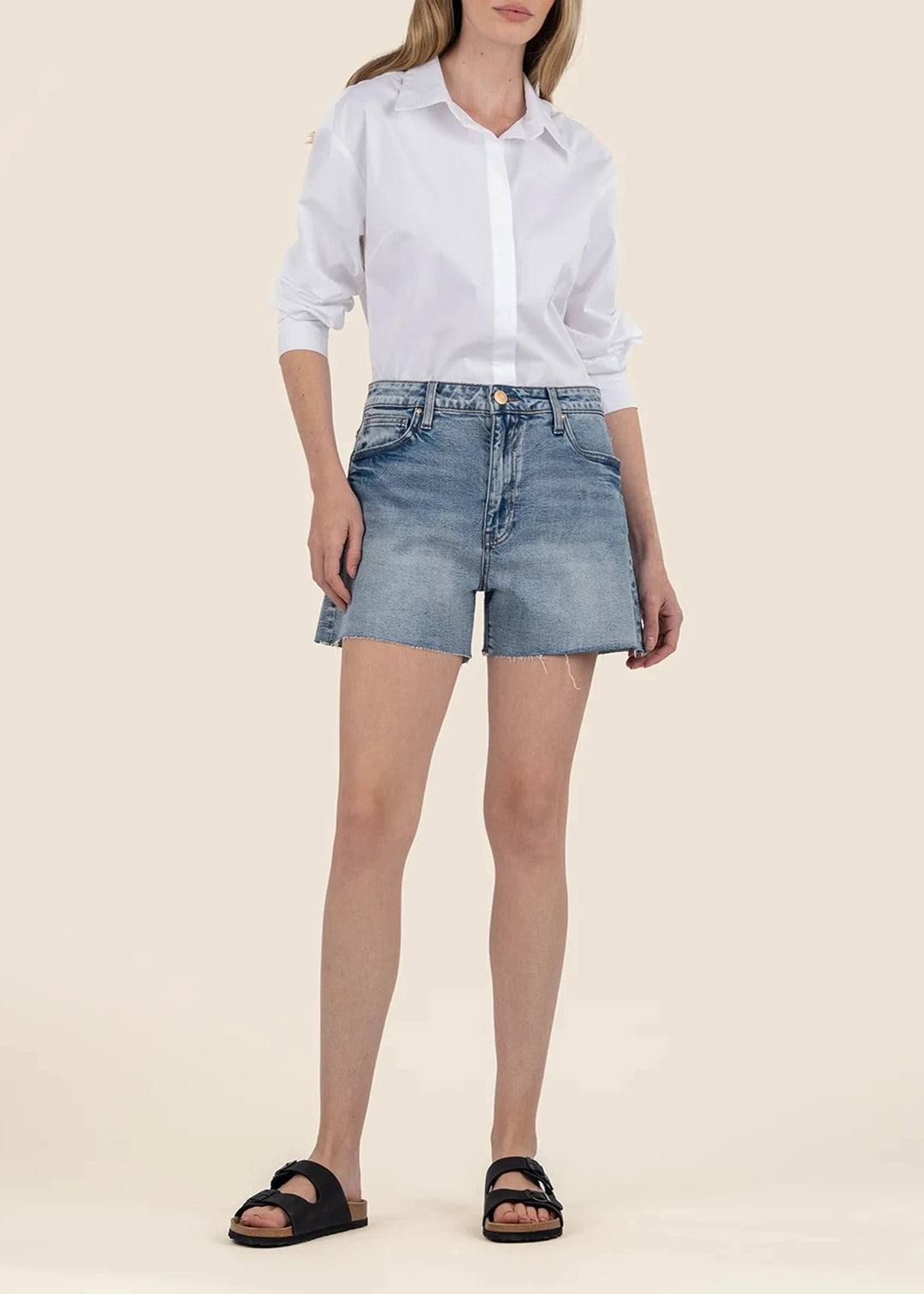 Women's medium wash raw hem high rise denim shorts