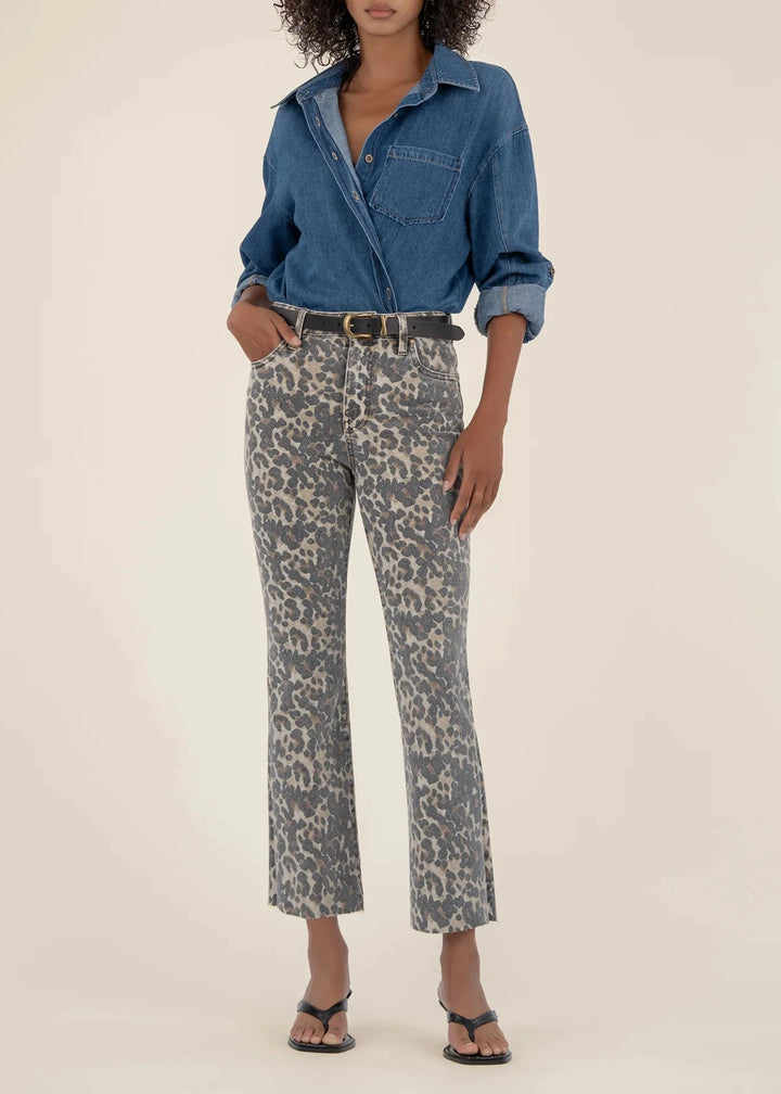 woman wearing tan and brown leopard print, high rise, ankle flare jeans with raw hems