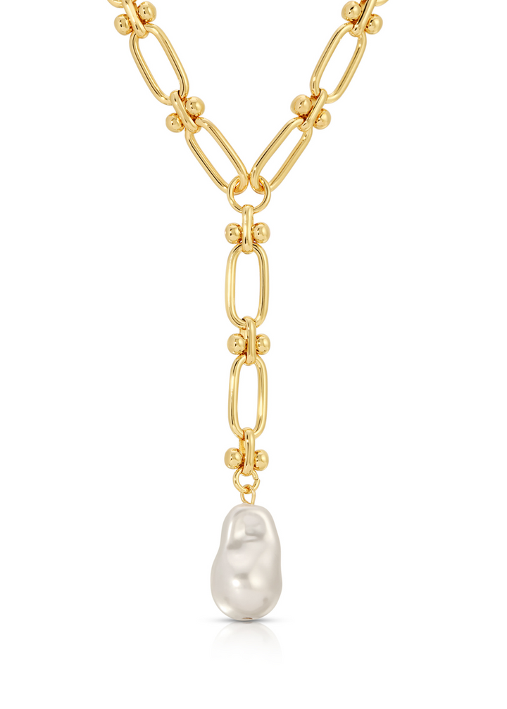 Women's gold lariat necklace with a large pearl