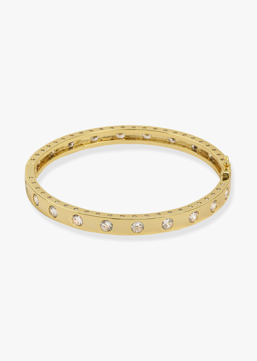 Gold cuff bracelet with CZ studding against a white background
