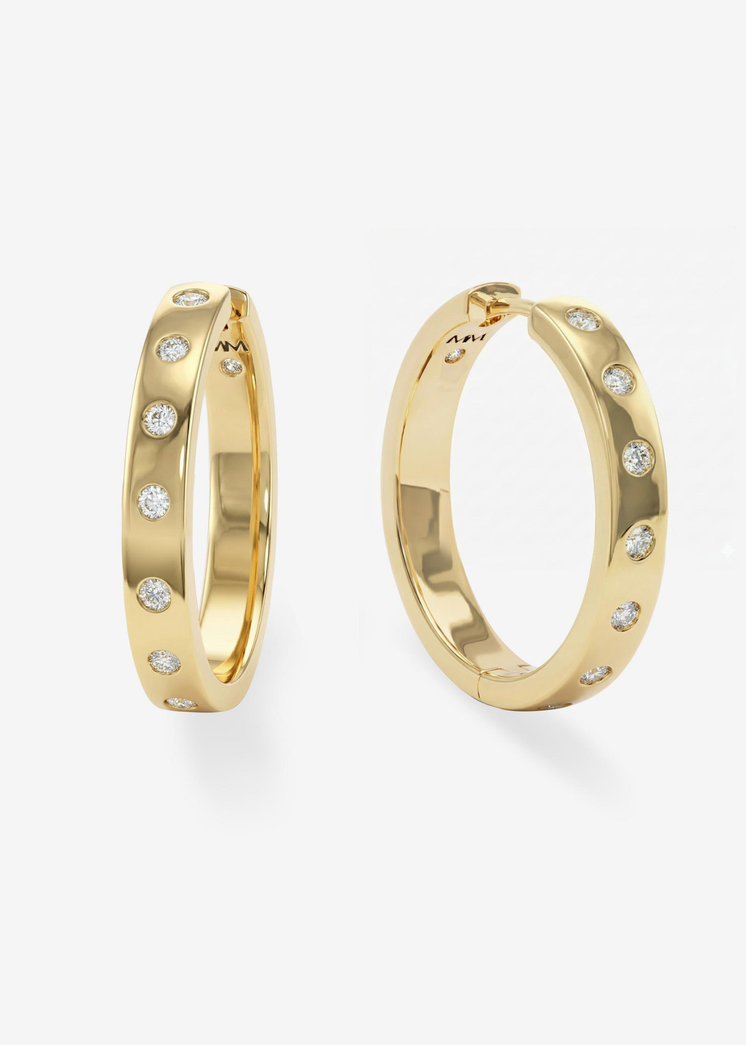 A pair of gold hoop earrings with CZ studding against a white background