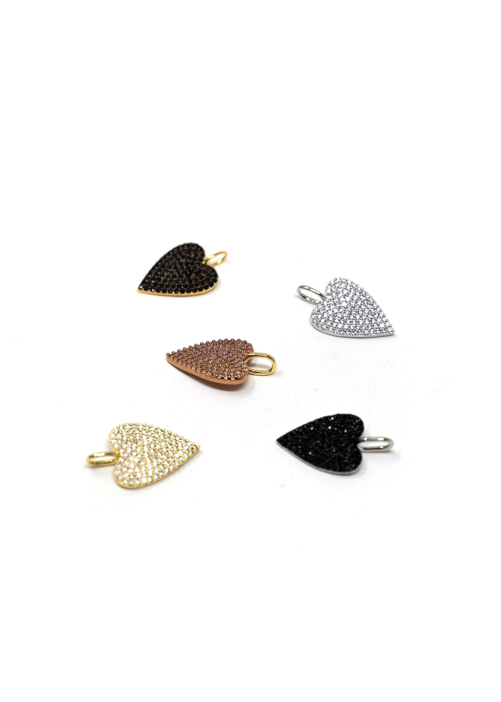 Multiple heart charms on a white background