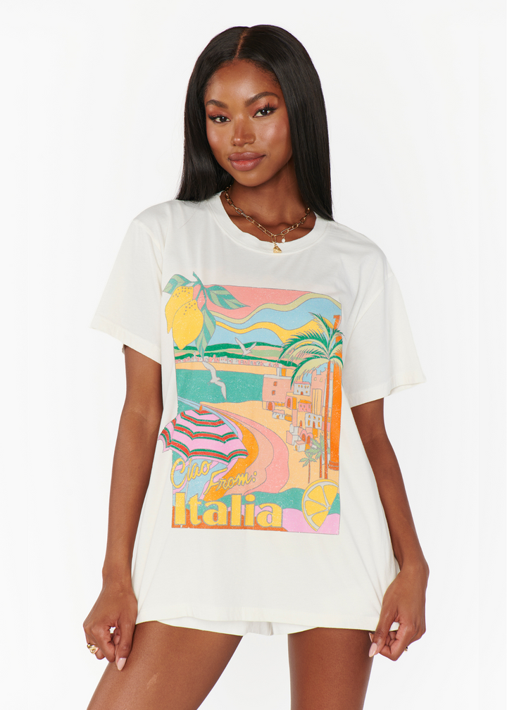 A woman wearing the Show Me Your Mumu Tom Tee with the Italia graphic in front of a white background
