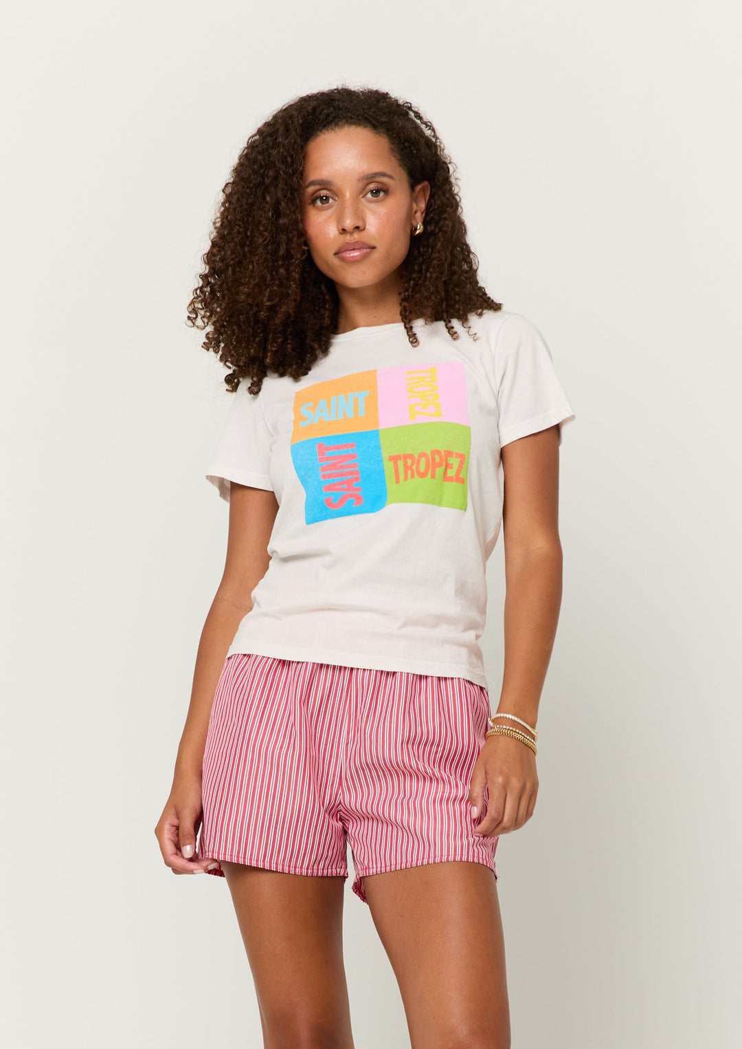 white short sleeve tee with pink, green, orange, and blue "Saint Tropez" chest graphic