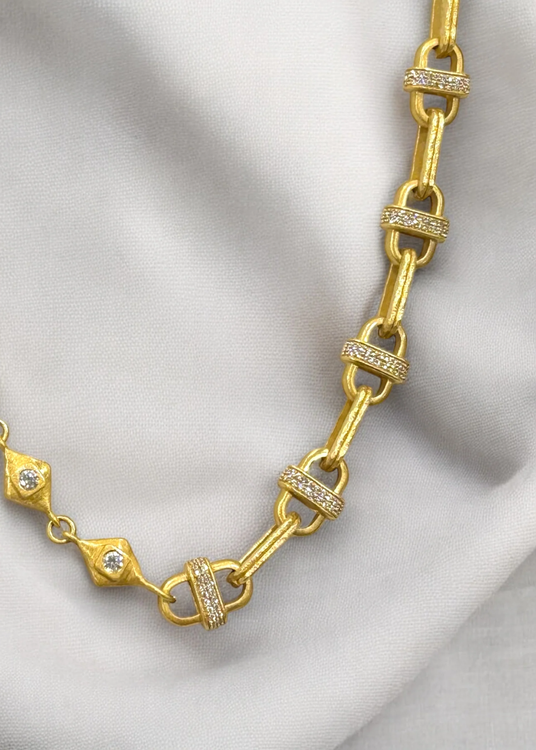 Gold chain necklace on a white background