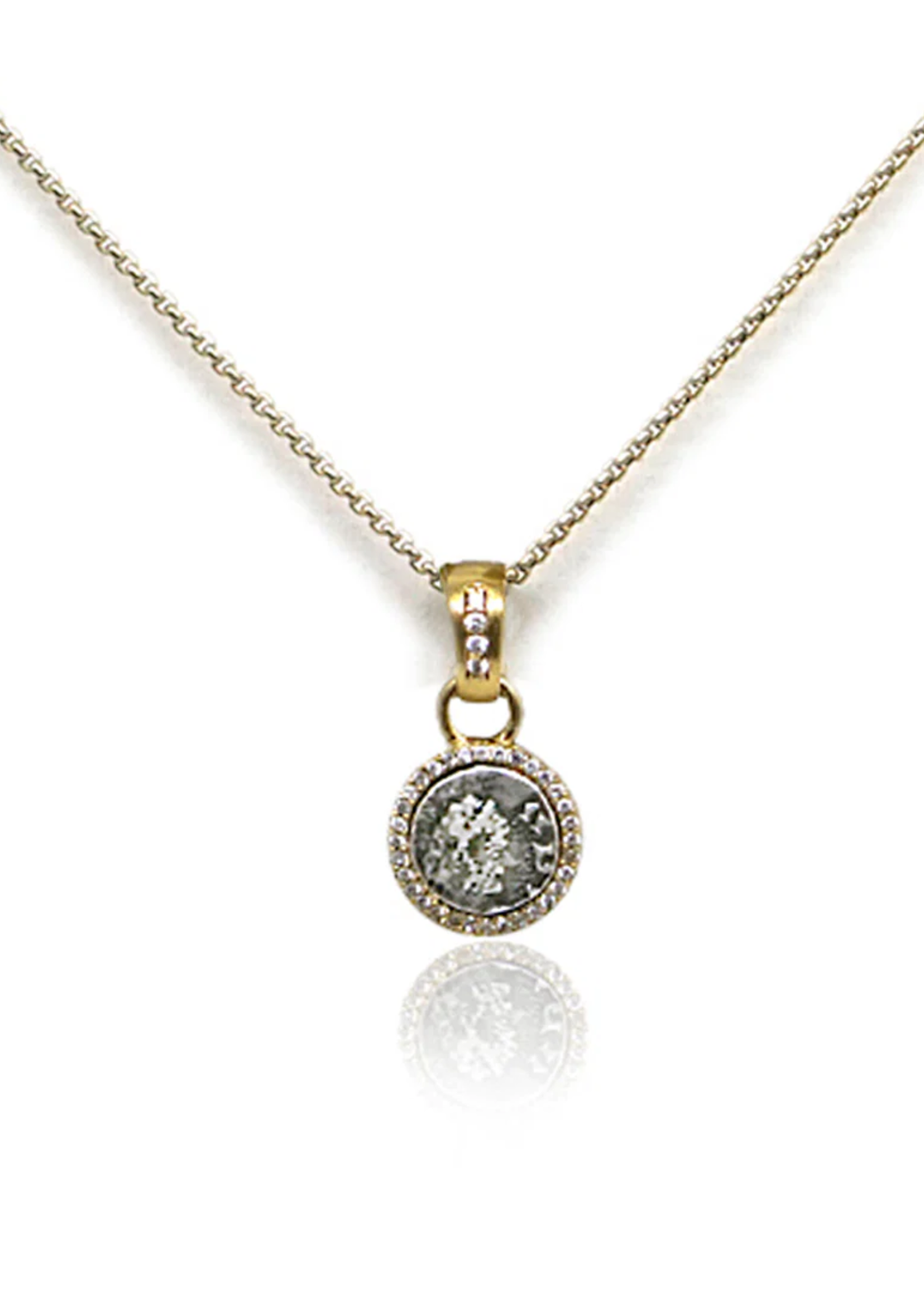 Gold chain necklace with a silver coin pendant framed in gold and CZ pave