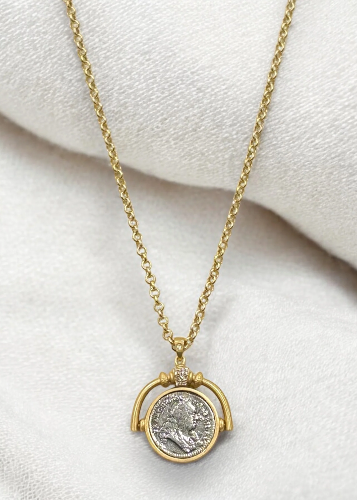 Gold necklace with a spinner and vintage coin pendant