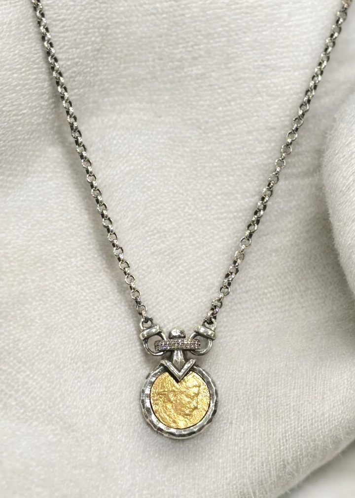 Vintage silver chain necklace with a gold coin