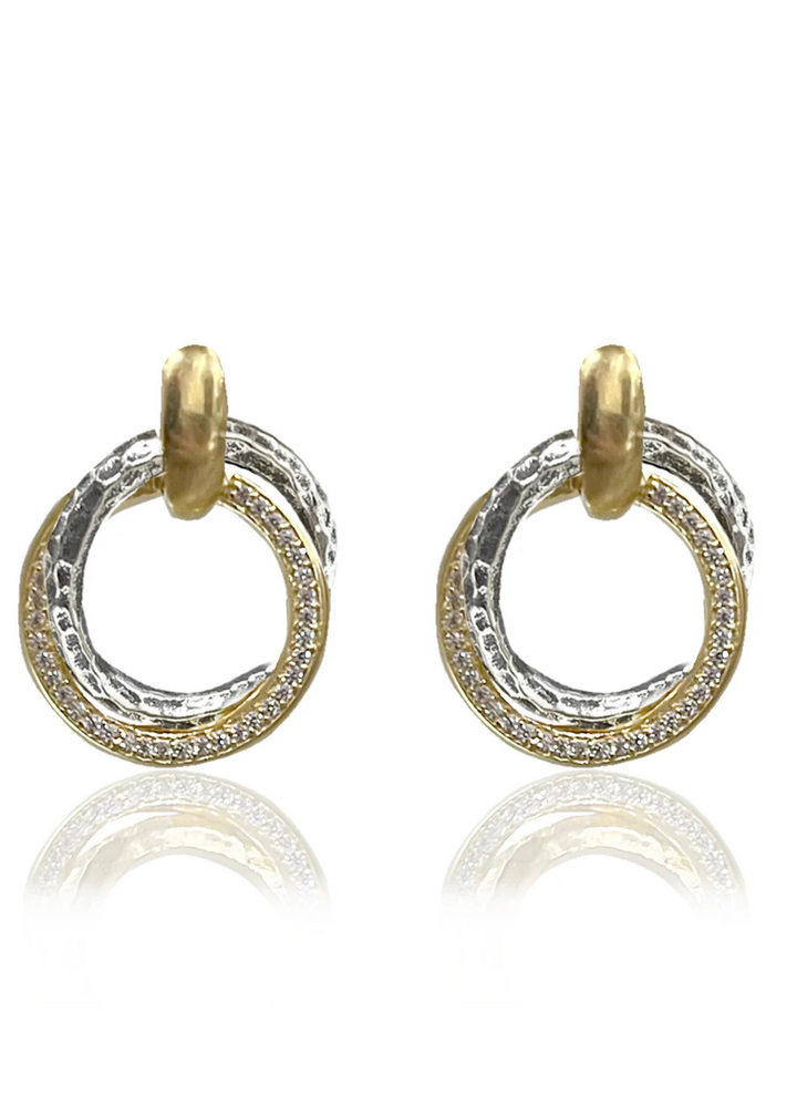 Mixed metal twisted circle earrings with CZ details on a white background