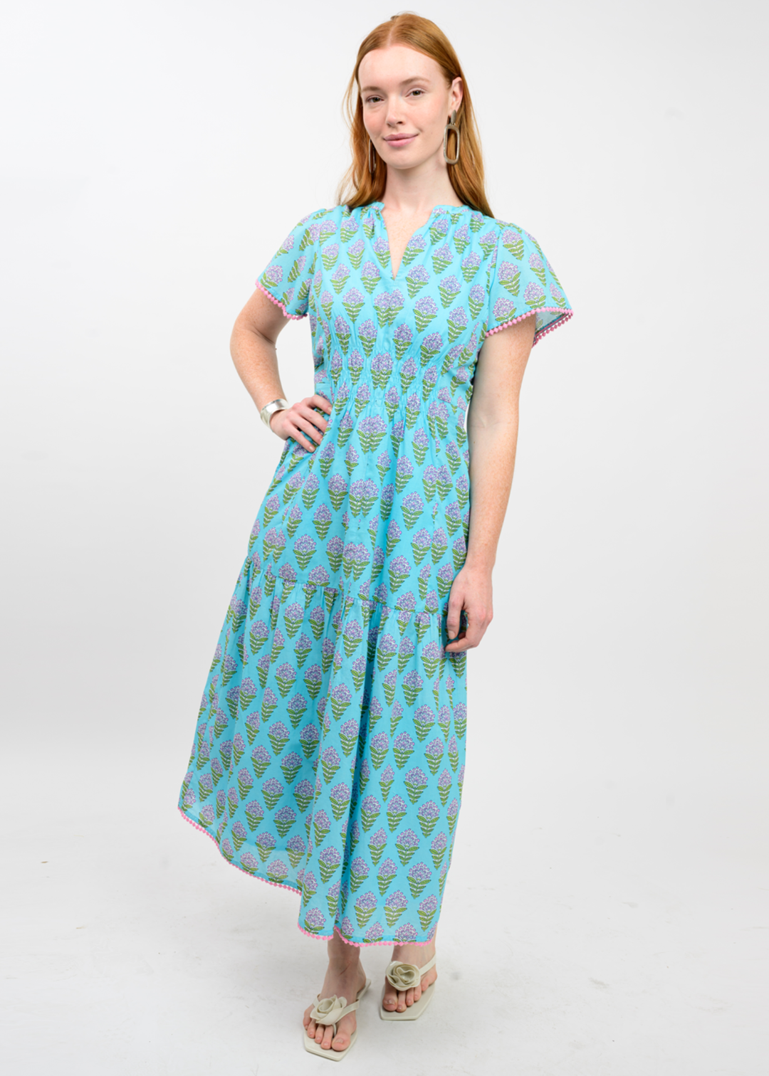 Woman wearing a blue floral print midi dress