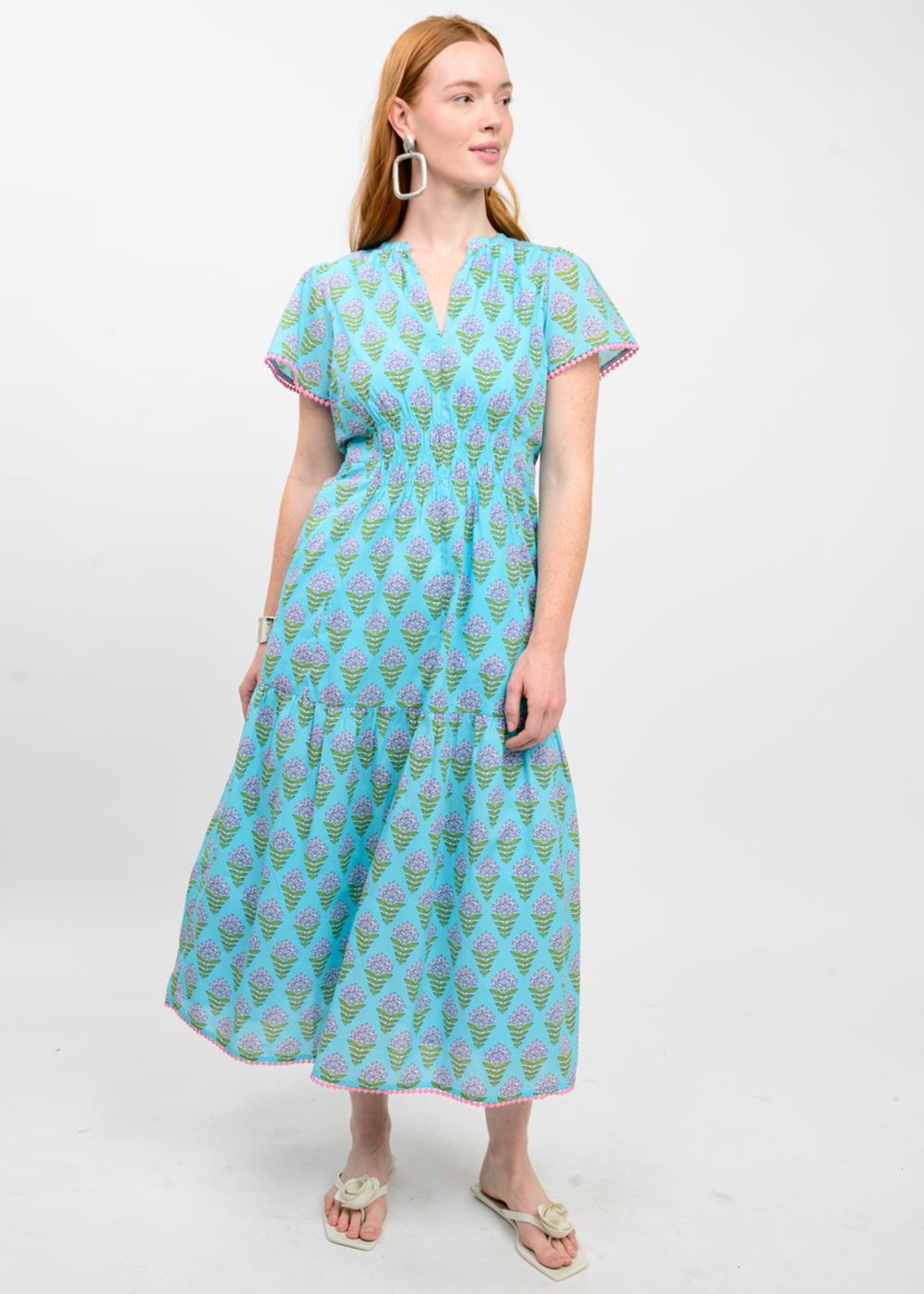 Woman wearing a blue floral print midi dress