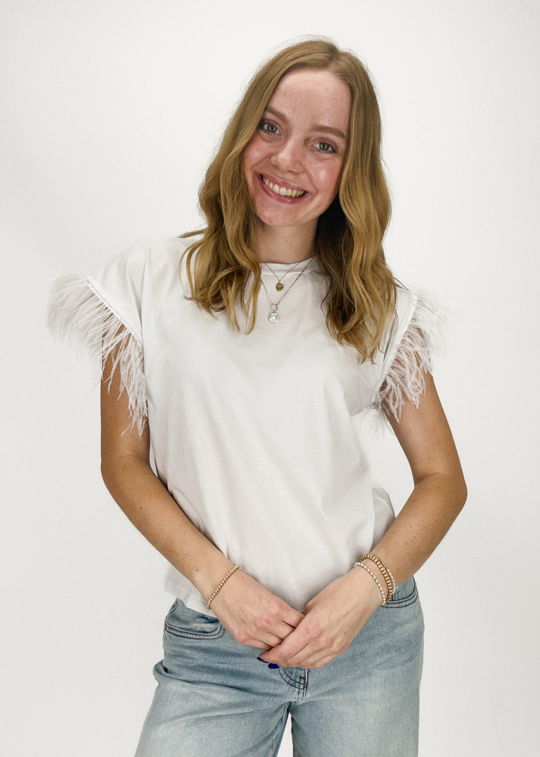 white short sleeve tee with feather sleeves